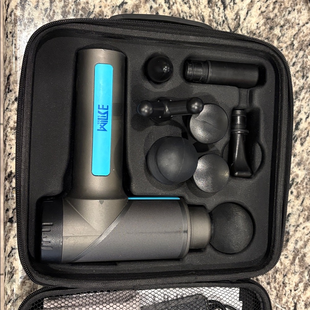 Gray and Blue Massage Gun with Attachments